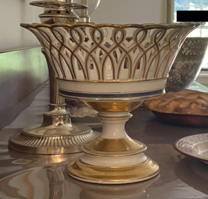 The fruit bowl was not purely decorative, though it does also serve as decoration. These fruit bowls often featured pressed glass detailing or hand painted ceramic patterns. Like all decorative dishes of the early nineteenth century, these bowls were meant to point to the owner’s good taste or material wealth.